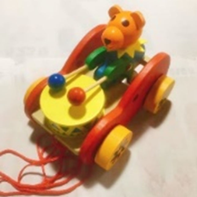 Cartoon bear pulls a cart