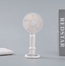 A handheld fan diffuses scent